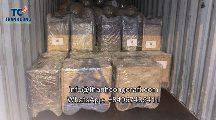 rattan cabinets into a container for delivery to Dubai