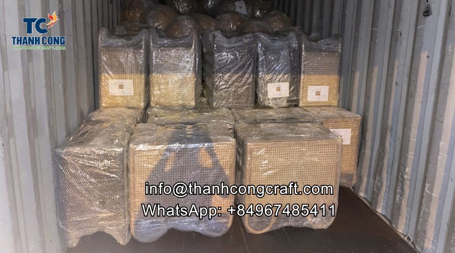 rattan cabinets into a container for delivery to Dubai